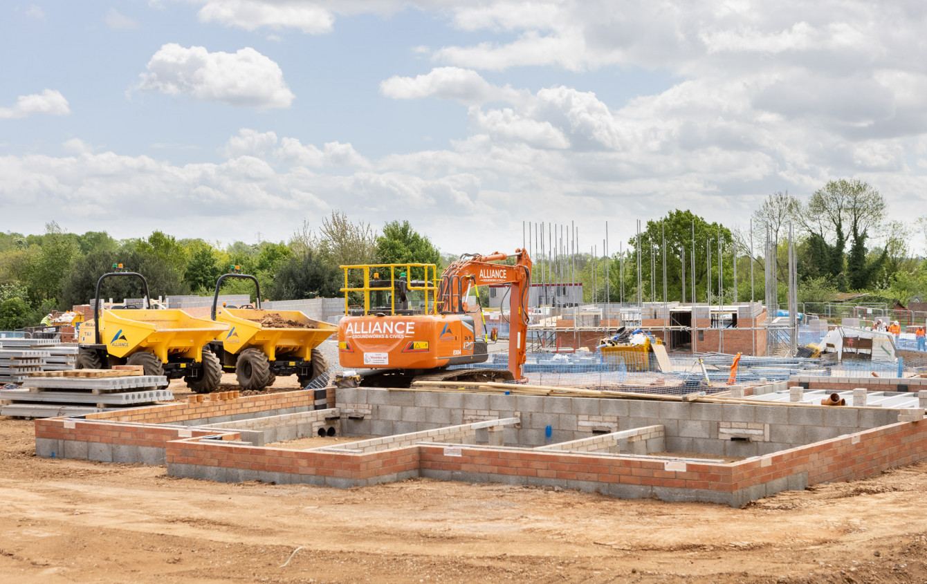 Alliance dumpers and excavator working on a residential site